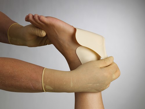 a close-up of hands holding a ball